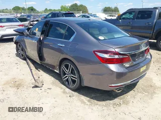 2017 Honda Accord Touring with VIN 1HGCR3F97HA041159, listed as a IAAI auction lot 42205195 with Not provided miles and . Bid and sale history available at DreamBid. Image 3.