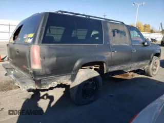 1997 GMC Suburban z VIN 3GKFK16R3VG511306, wystawiony jako Copart lot #78504814 z przebiegiem 287 079 mil mil oraz Szkoda całkowita • Salvage title. Historia ofert i sprzedaży dostępna na DreamBid. Obrazek 3.