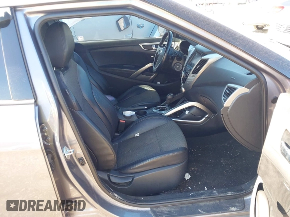 2016 Hyundai Veloster z VIN KMHTC6AD9GU264048, wystawiony jako IAAI lot #41634443 z przebiegiem 103 758 mil mil oraz . Historia ofert i sprzedaży dostępna na DreamBid. Obrazek 5.