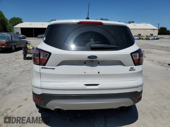 2017 Ford Escape SE z VIN 1FMCU0G9XHUC38315, wystawiony jako Copart lot #50998095 z przebiegiem 81 110 mil mil oraz Czysty tytuł • Clean title. Historia ofert i sprzedaży dostępna na DreamBid. Obrazek 6.