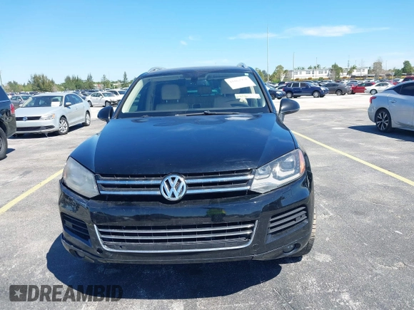 2013 Volkswagen Touareg Lux with VIN WVGEF9BP6DD004454, listed as a IAAI auction lot 41862958 with 239,548 mi miles and . Bid and sale history available at DreamBid. Image 12.