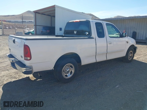 2002 Ford F-150 XL with VIN 1FTRX17W22KE34494, listed as a IAAI auction lot 41689313 with 250,243 mi miles. Bid and sale history available at carsss.com. Image 4.