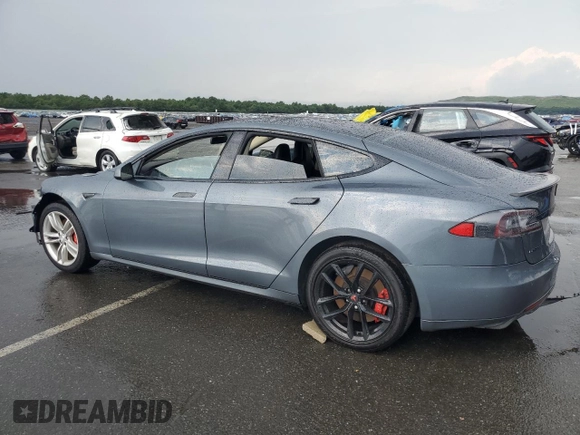 2014 Tesla Model S 60 with VIN 5YJSA1H14EFP28471, listed as a Copart auction lot 64928534 with 99,442 mi miles and Clean Title. Bid and sale history available at DreamBid. Image 2.