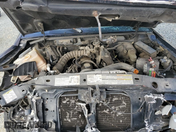1999 Ford Ranger XL with VIN 1FTYR10C0XTA88744, listed as a Copart auction lot 44258415 with 202,709 mi miles and Salvage title. Bid and sale history available at DreamBid. Image 12.