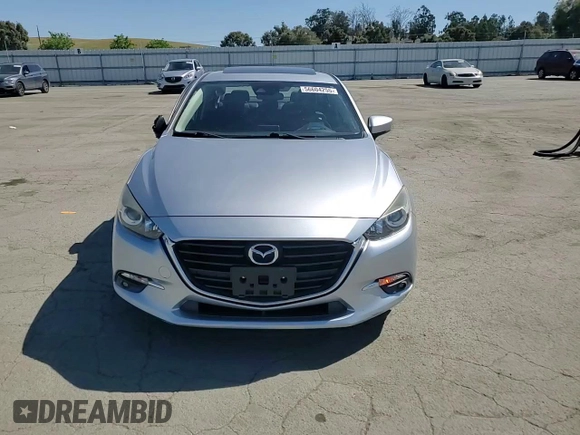 2017 Mazda 3 Grand Touring z VIN 3MZBN1W37HM141705, wystawiony jako Copart lot #56604255 z przebiegiem 62 308 mil mil oraz Szkoda całkowita • Salvage title. Historia ofert i sprzedaży dostępna na DreamBid. Obrazek 13.