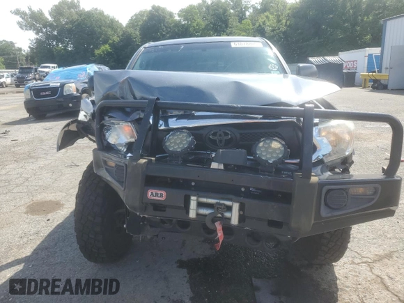 2014 Toyota Tacoma with VIN 3TMLU4EN2EM163797, listed as a Copart auction lot 61078805 with 130,748 mi miles and Salvage title. Bid and sale history available at DreamBid. Image 5.