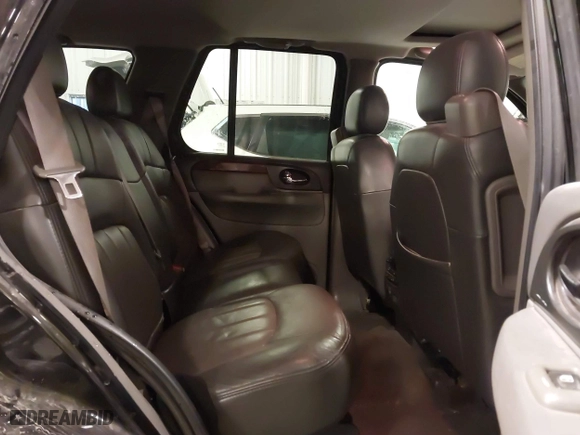 2004 GMC Envoy SLE with VIN 1GKDT13S542265104, listed as a IAAI auction lot 41884797 with 154,190 mi miles. Bid and sale history available at carsss.com. Image 8.