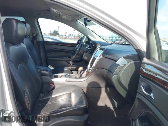 2014 Cadillac SRX Performance Collection with VIN 3GYFNCE39ES544135, listed as a IAAI auction lot 41808644 with 145,772 mi miles and . Bid and sale history available at carsss.com. Image 5.