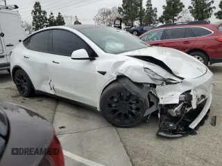 2021 Tesla Model Y Long Range with VIN 5YJYGDEE3MF214823, listed as a Copart auction lot 50738045 with 63,227 mi miles and Salvage Title. Bid and sale history available at DreamBid. Image 4.