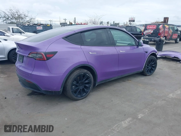 2021 Tesla Model Y Long Range with VIN 5YJYGDEE7MF224531, listed as a IAAI auction lot 38454442 with 52,408 mi miles. Bid and sale history available at carsss.com. Image 4.