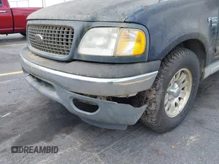 2003 Ford F-150 XLT with VIN 1FTRW076X3KC61967, listed as a IAAI auction lot 42016065 with 206,256 mi miles. Bid and sale history available at carsss.com. Image 6.
