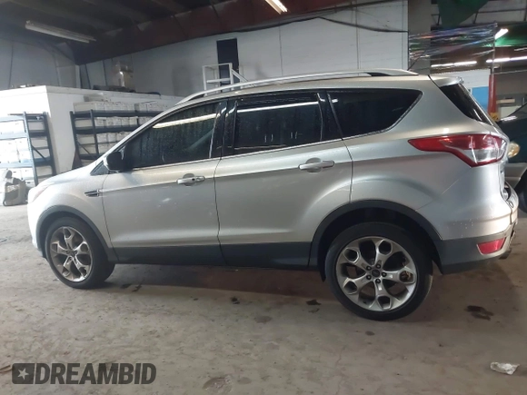 2015 Ford Escape Titanium z VIN 1FMCU9J96FUB23902, wystawiony jako IAAI lot #42497188 z przebiegiem 164 452 mil mil oraz . Historia ofert i sprzedaży dostępna na DreamBid. Obrazek 14.