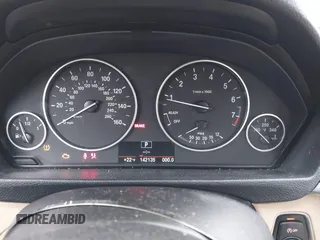 2014 BMW 3 Series 328i with VIN WBA3C1C51EK106435, listed as a IAAI auction lot 41202983 with 142,135 mi miles. Bid and sale history available at carsss.com. Image 7.