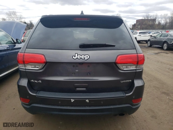 2015 Jeep Grand Cherokee Altitude with VIN 1C4RJFAG0FC209734, listed as a Copart auction lot 52973105 with 130,955 mi miles and Salvage Title. Bid and sale history available at carsss.com. Image 6.