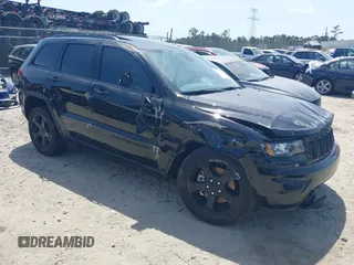 2021 Jeep Grand Cherokee Laredo E with VIN 1C4RJEAG9MC740244, listed as a IAAI auction lot 42112847 with 32,897 mi miles and . Bid and sale history available at DreamBid. Image 1.