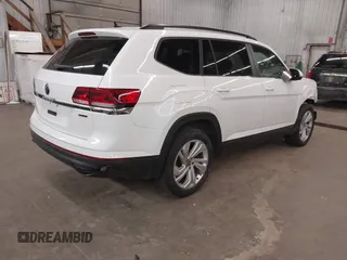 2021 Volkswagen Atlas SE z VIN 1V2HR2CA3MC539997, wystawiony jako IAAI lot #41977786 z przebiegiem 77 372 mil mil oraz . Historia ofert i sprzedaży dostępna na DreamBid. Obrazek 4.