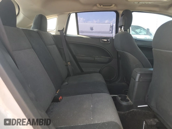 2011 Dodge Caliber Heat z VIN 1B3CB5HA7BD222260, wystawiony jako Copart lot #54451535 z przebiegiem 124 930 mil mil oraz Czysty tytuł • Clean title. Historia ofert i sprzedaży dostępna na DreamBid. Obrazek 11.