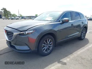 2021 Mazda CX-9 Sport with VIN JM3TCBBY7M0520437, listed as a IAAI auction lot 42022562 with 77,063 mi miles and . Bid and sale history available at DreamBid. Image 17.
