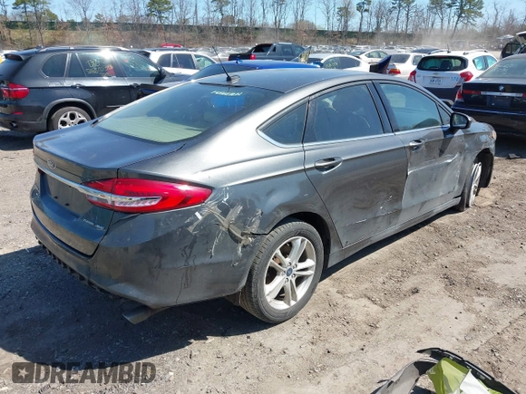 2018 Ford Fusion SE z VIN 3FA6P0H74JR233829, wystawiony jako IAAI lot #42049766 z przebiegiem 120 370 mil mil oraz . Historia ofert i sprzedaży dostępna na DreamBid. Obrazek 4.