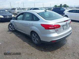 2017 Ford Focus SE with VIN 1FADP3FE4HL295573, listed as a IAAI auction lot 39562568 with 96,939 mi miles and . Bid and sale history available at carsss.com. Image 3.