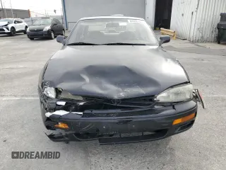 1995 Toyota Camry LE with VIN JT2GK12E2S0079545, listed as a Copart auction lot 84058164 with 150,539 mi miles and Salvage Title. Bid and sale history available at carsss.com. Image 5.