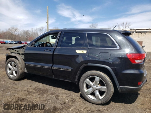 2013 Jeep Grand Cherokee Overland with VIN 1C4RJFCT2DC576125, listed as a Copart auction lot 52595165 with 100,361 mi miles and Salvage Title. Bid and sale history available at carsss.com. Image 2.