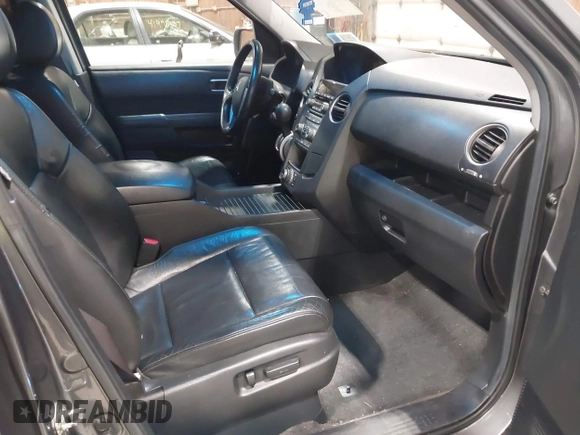 2012 Honda Pilot Touring with VIN 5FNYF4H99CB052034, listed as a IAAI auction lot 42023430 with 137,428 mi miles. Bid and sale history available at carsss.com. Image 5.