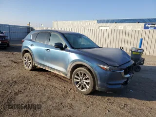 2020 Mazda CX-5 Grand Touring with VIN JM3KFBDM1L0727482, listed as a Copart auction lot 82976114 with 103,707 mi miles and Salvage Title. Bid and sale history available at carsss.com. Image 4.
