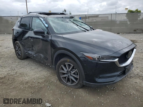 2018 Mazda CX-5 Grand Touring with VIN JM3KFADM3J1370114, listed as a Copart auction lot 54579585 with 65,513 mi miles and Salvage Title. Bid and sale history available at DreamBid. Image 4.