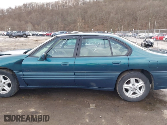 1996 Pontiac Bonneville z VIN 1G2HZ5210TH210829, wystawiony jako IAAI lot #41203888 z przebiegiem 154 990 mil mil oraz . Historia ofert i sprzedaży dostępna na DreamBid. Obrazek 14.