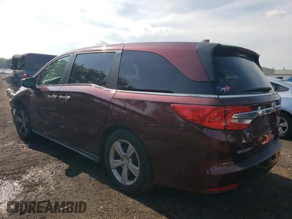 2018 Honda Odyssey EX with VIN 5FNRL6H55JB037386, listed as a Copart auction lot 63577475 with 125,498 mi miles and Salvage title. Bid and sale history available at DreamBid. Image 2.