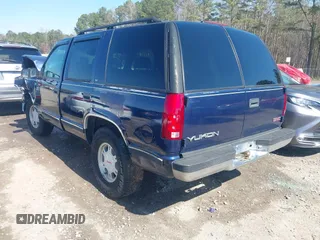 1999 GMC Yukon with VIN 1GKEK13R2XJ708582, listed as a IAAI auction lot 41698586 with 252,630 mi miles. Bid and sale history available at carsss.com. Image 3.