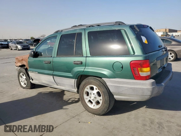 1999 Jeep Grand Cherokee Laredo with VIN 1J4G258S0XC561054, listed as a Copart auction lot 49814555 with Not provided miles and Salvage title. Bid and sale history available at DreamBid. Image 2.
