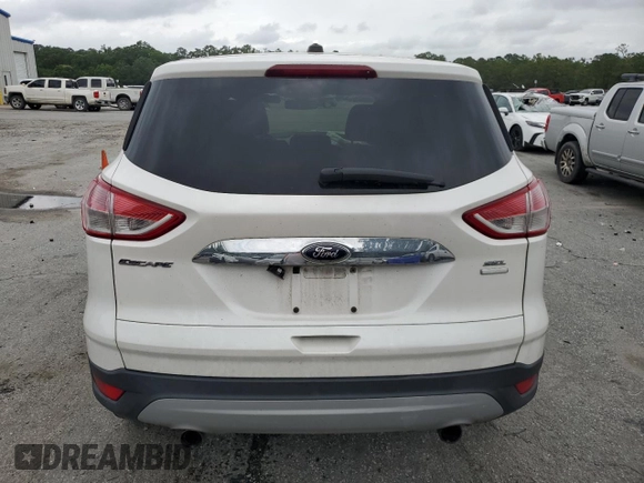 2013 Ford Escape SEL z VIN 1FMCU9HX4DUB05173, wystawiony jako Copart lot #57918125 z przebiegiem 197 195 mil mil oraz Szkoda całkowita • Salvage title. Historia ofert i sprzedaży dostępna na DreamBid. Obrazek 6.