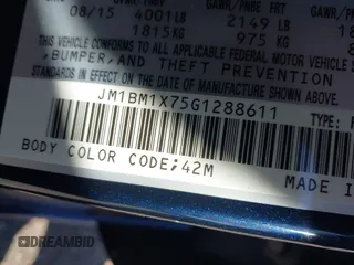 2016 Mazda Mazda3 i Grand Touring with VIN JM1BM1X75G1288611, listed as a IAAI auction lot 42001357 with 107,830 mi miles. Bid and sale history available at carsss.com. Image 9.