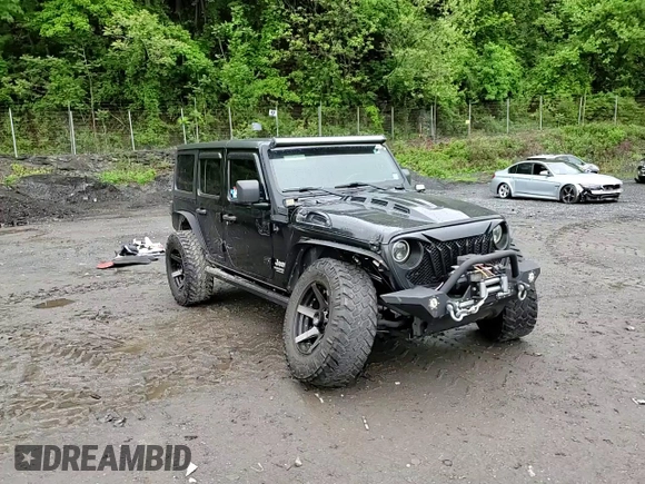 2018 Jeep Wrangler Unlimited Sport S z VIN 1C4HJXDG4JW137697, wystawiony jako Copart lot #56577525 z przebiegiem 42 297 mil mil oraz Szkoda całkowita • Salvage title. Historia ofert i sprzedaży dostępna na DreamBid. Obrazek 14.