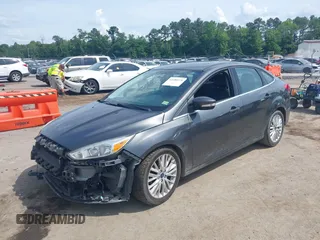 2017 Ford Focus Titanium with VIN 1FADP3J27HL306546, listed as a IAAI auction lot 42480576 with 114,285 mi miles and . Bid and sale history available at DreamBid. Image 18.
