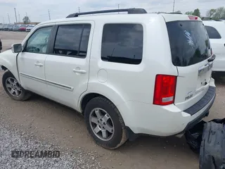 2011 Honda Pilot Touring z VIN 5FNYF4H96BB106873, wystawiony jako IAAI lot #42154795 z przebiegiem 162 282 mil mil oraz . Historia ofert i sprzedaży dostępna na DreamBid. Obrazek 3.