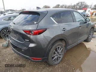 2018 Mazda CX-5 Grand Touring with VIN JM3KFBDM8J0441867, listed as a IAAI auction lot 41565147 with 62,466 mi miles. Bid and sale history available at carsss.com. Image 4.