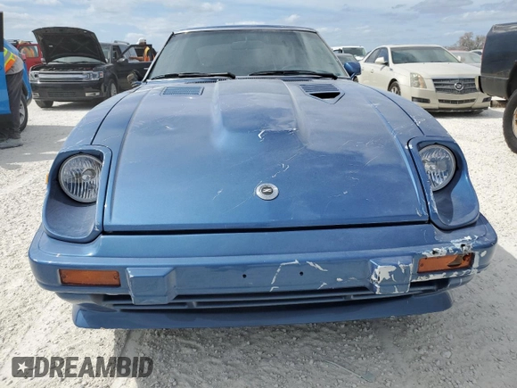 1982 Datsun 280ZX z VIN JN1HZ04S5CX457910, wystawiony jako Copart lot #77132604 z przebiegiem 261 383 mil mil oraz Szkody całkowita. Historia ofert i sprzedaży dostępna na DreamBid. Obrazek 5.