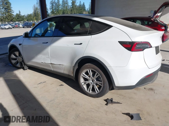 2024 Tesla Model Y Long Range with VIN 7SAYGAEEXRF988561, listed as a IAAI auction lot 42058248 with 7,845 mi miles. Bid and sale history available at carsss.com. Image 3.