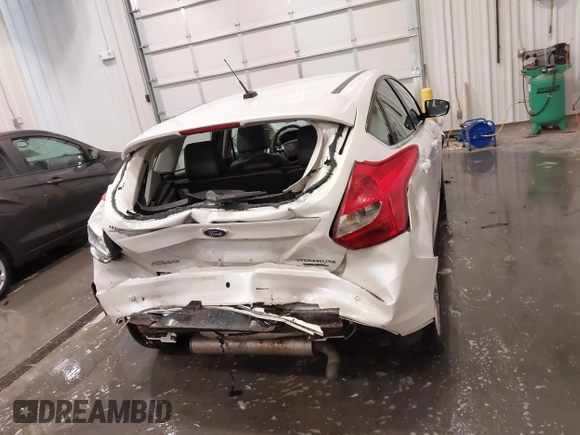 2014 Ford Focus Titanium with VIN 1FADP3N27EL110287, listed as a IAAI auction lot 42210697 with 107,741 mi miles and . Bid and sale history available at DreamBid. Image 16.
