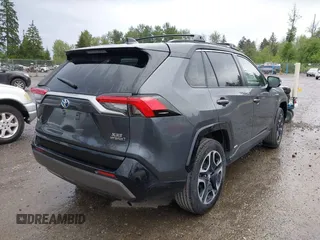 2021 Toyota RAV4 Hybrid XSE with VIN 2T3E6RFV4MW004081, listed as a IAAI auction lot 42300195 with 63,238 mi miles and . Bid and sale history available at DreamBid. Image 4.