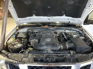 2011 Nissan Frontier Pro-4X с VIN 1N6AD0EV7BC411763, выставлен на аукционе Copart как лот 82966494 с пробегом 224 775 миль миль и Списание • Salvage title. История ставок и продаж доступна на DreamBid. Изображение 11.
