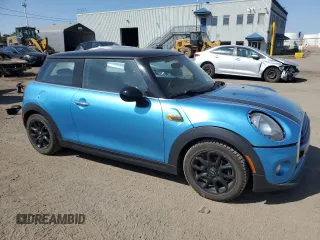 2017 MINI Hardtop Cooper with VIN WMWXP5C33H2G60921, listed as a Copart auction lot 58139295 with 94,599 mi miles and Salvage title. Bid and sale history available at DreamBid. Image 4.