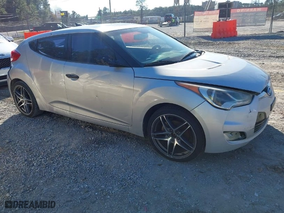 2012 Hyundai Veloster w/Gray Int with VIN KMHTC6AD8CU023009, listed as a IAAI auction lot 41668766 with 132,006 mi miles. Bid and sale history available at carsss.com. Image 1.