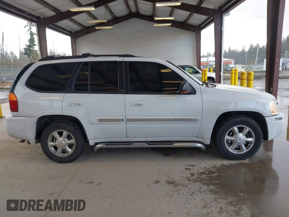 2003 GMC Envoy SLE with VIN 1GKDT13SX32319740, listed as a IAAI auction lot 41923578 with 210,811 mi miles. Bid and sale history available at carsss.com. Image 13.