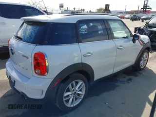 2014 MINI Countryman S with VIN WMWZC3C52EWP26869, listed as a IAAI auction lot 41756310 with 91,941 mi miles and . Bid and sale history available at DreamBid. Image 4.