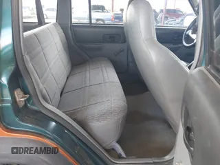 1997 Jeep Cherokee Sport with VIN 1J4FJ68SXVL517077, listed as a IAAI auction lot 42350553 with Not provided miles and . Bid and sale history available at DreamBid. Image 8.