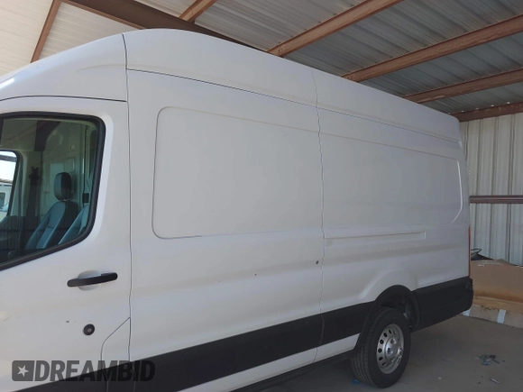 2022 Ford Transit Cargo with VIN 1FTBW3X89NKA69141, listed as a IAAI auction lot 41980864 with 102,721 mi miles and . Bid and sale history available at DreamBid. Image 14.